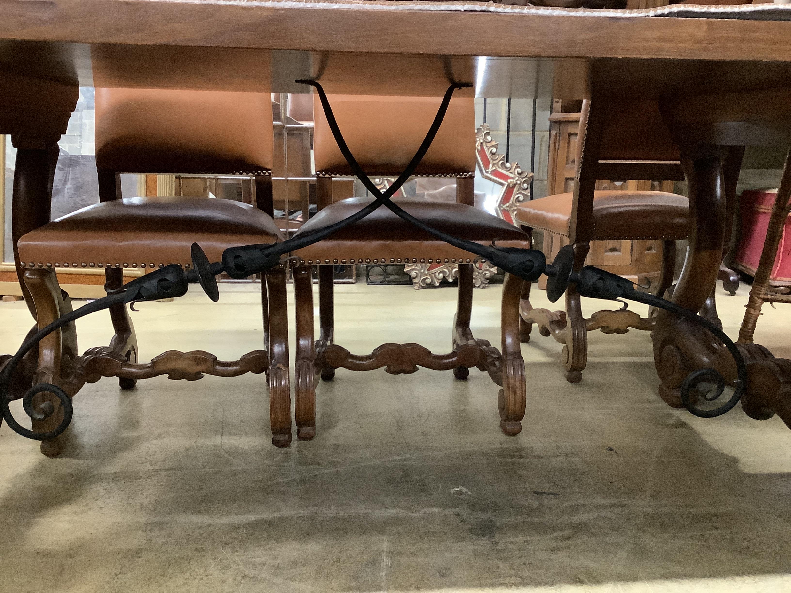 A Spanish walnut and fruitwood rectangular table, width 200cm, depth 84cm, height 77cm together with nine matching high back dining chairs